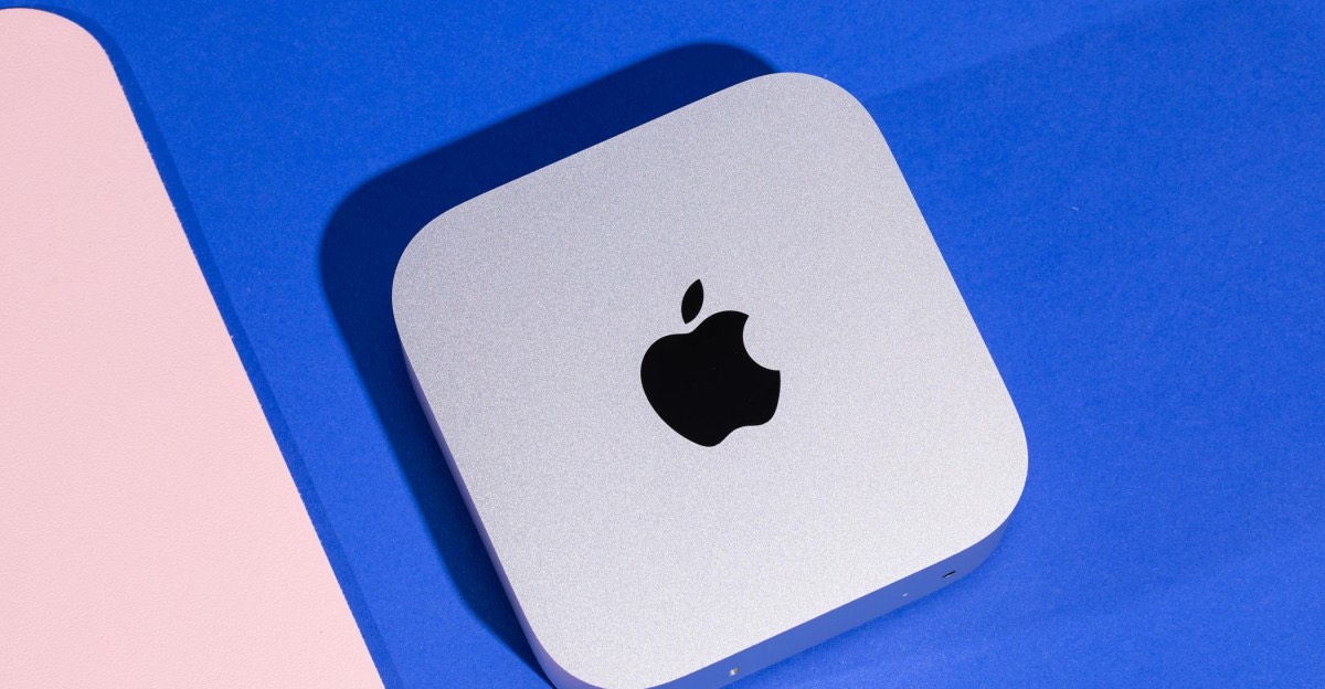 A Mac mini on a blue background