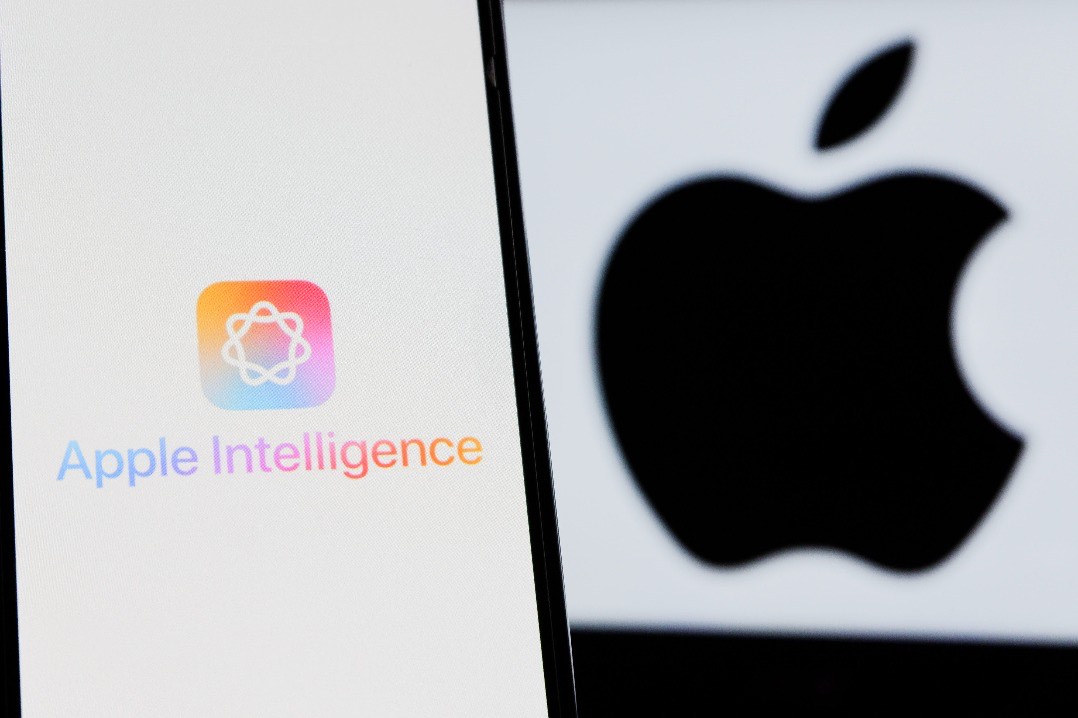 A lit phone screen showing the Apple Intelligence logo and wordmark beside an enlarged Apple logo