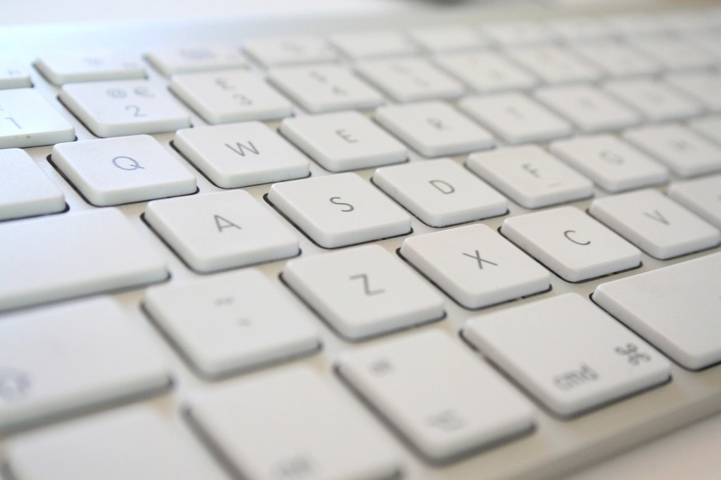 A close-up of a white keyboard at an angle