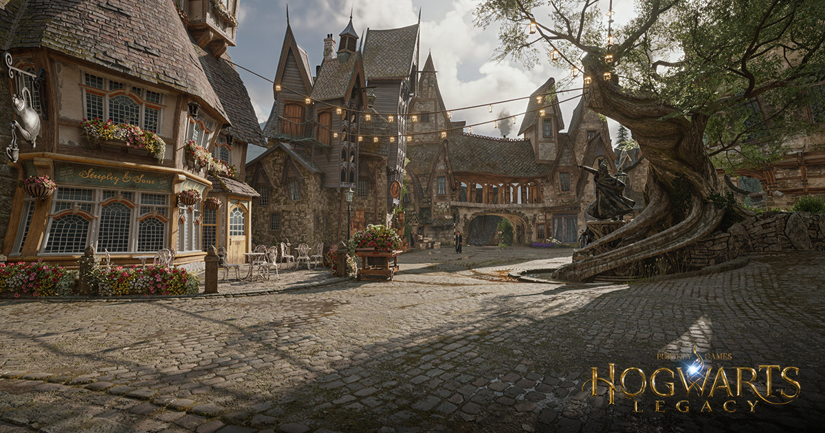 石砌奇幻村镇的街道与高耸建筑，画面右下角印有 Hogwarts Legacy 字样