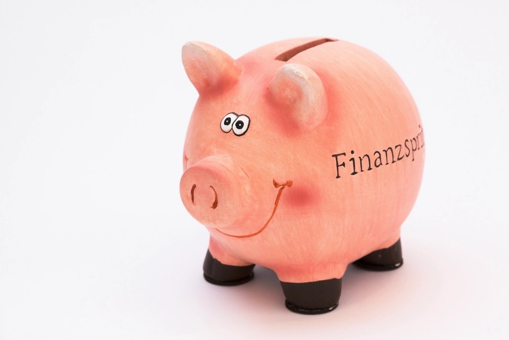 A pink piggy bank on a white background