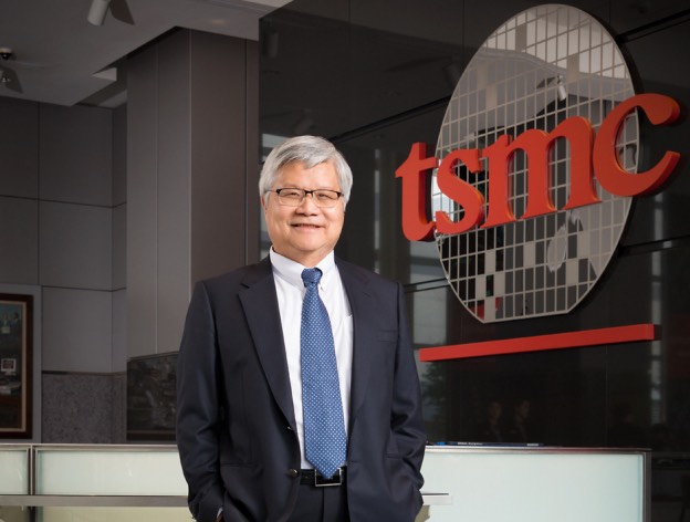 TSMC CEO C.C. Wei standing in front of the company logo